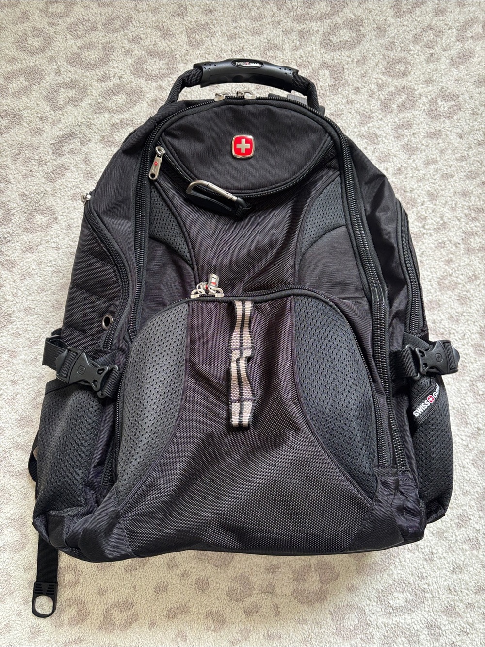 SwissGear Black Travel Backpack with Red Logo Accent